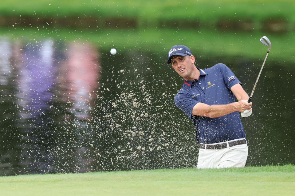 Chesson Hadley plays a shot from the green side bunker on the 16th hole during the third round of the Travelers Championship golf tournament. Mandatory Credit: Vincent Carchietta-USA TODAY Sports