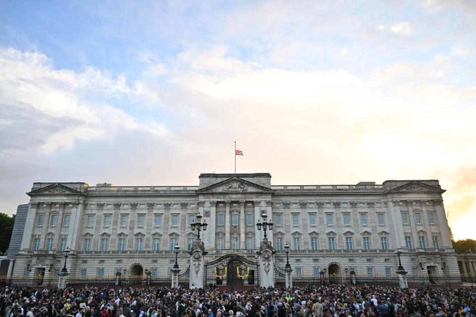 LONDON, ENGLAND - SEPTEMBER 08: The Union flag flies half mast as people gather at Buckingham Palace on September 08, 2022 in London, England. Elizabeth Alexandra Mary Windsor was born in Bruton Street, Mayfair, London on 21 April 1926. She married Prince Philip in 1947 and acceded the throne of the United Kingdom and Commonwealth on 6 February 1952 after the death of her Father, King George VI.Queen Elizabeth II died at Balmoral Castle in Scotland on September 8, 2022, and is survived by her four children, Charles, Prince of Wales, Anne, Princess Royal, Andrew, Duke Of York and Edward, Duke of Wessex. (Photo by Samir Hussein/WireImage)