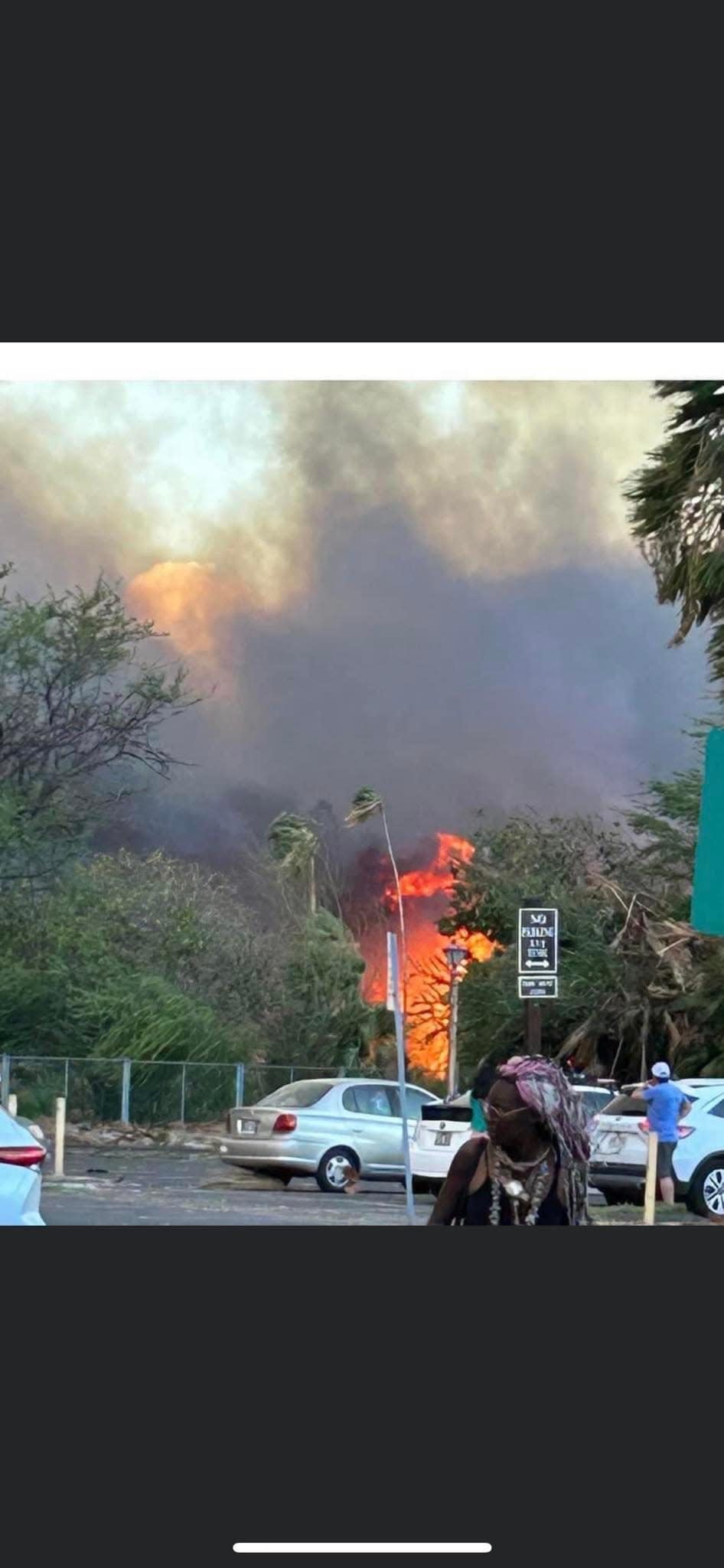 Flames from the deadly wildfires in Maui approach the parking lot of the Lahaina Shores Beach Resort.