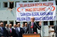 This handout picture released by the Turkish Presidential Press Service on July 29, 2016 shows Turkish President Recep Tayyip Erdogan (R) speaking at the Police Special Operation Department's Headquarters in Golbasi district of Ankara