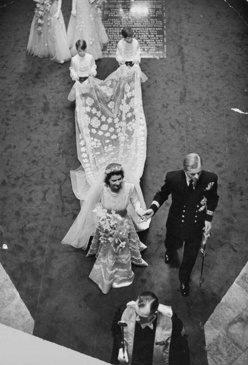 20th November 1947:  Queen Elizabeth II (as Princess Elizabeth) with Prince Philip, Duke of Edinburgh, on their wedding day in Westminster Abbey, London.  Original Publication: Picture Post - 4438 - Royal Wedding - pub. 1947  (Photo by Bert Hardy/Picture Post/Getty Images)