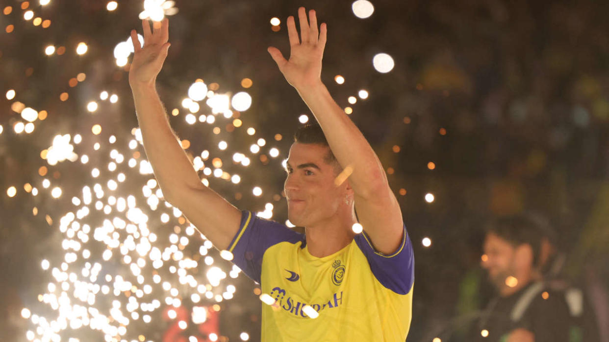 Al-Nassr's new Portuguese forward Cristiano Ronaldo greets the fans during his unveiling at the Mrsool Park Stadium in the Saudi capital Riyadh on January 3, 2023. (Photo by Fayez Nureldine / AFP)