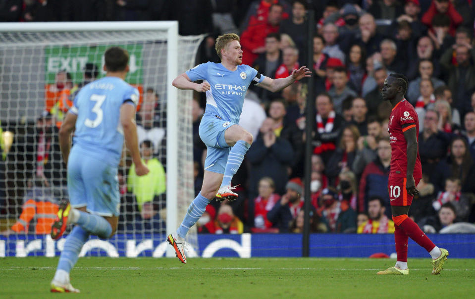 Manchester City's Kevin De Bruyne celebrates scoring his side's second goal , during the English Premier League soccer match between Liverpool and Manchester City at Anfield, Liverpool, England, Sunday Oct. 3, 2021. (Peter Byrne/PA via AP)
