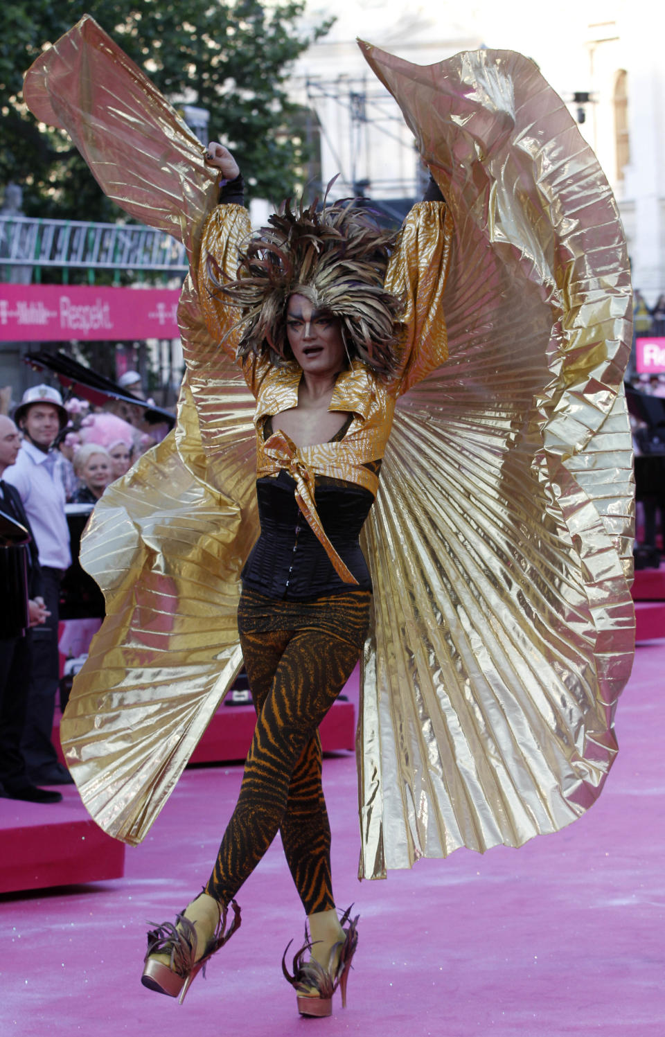 A guest in costume arrives for the opening ceremony of the 20th Life Ball in front of the city hall in Vienna, Austria, on Saturday, May 19, 2012. The Life Ball is a charity gala to raise money for people living with HIV and AIDS. (AP Photo/Ronald Zak)