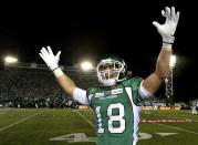 Saskatchewan Roughriders Scott McHenry celebrates his team's win over the Hamilton Tiger Cats in the CFL's 101st Grey Cup championship football game in Regina, Saskatchewan November 24, 2013. REUTERS/Todd Korol (CANADA - Tags: SPORT FOOTBALL)