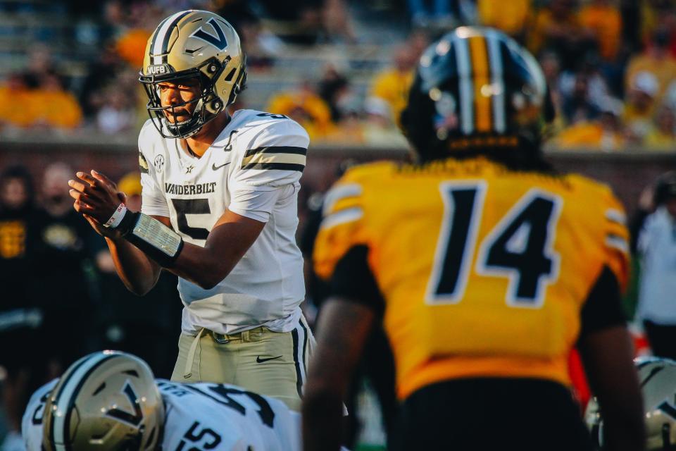 Vanderbilt quarterback Mike Wright prepares for a snap as Missouri defensive back Kris Abrams-Draine looms during the Tigers' 17-14 win over the Commodores on Oct. 22, 2022.
