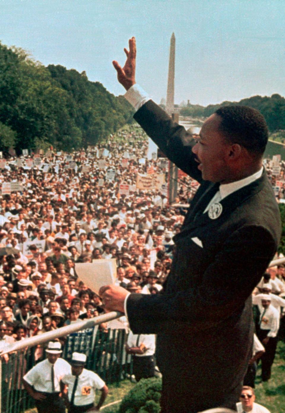 Martin Luther King, Jr., greets people during the March on Washington.