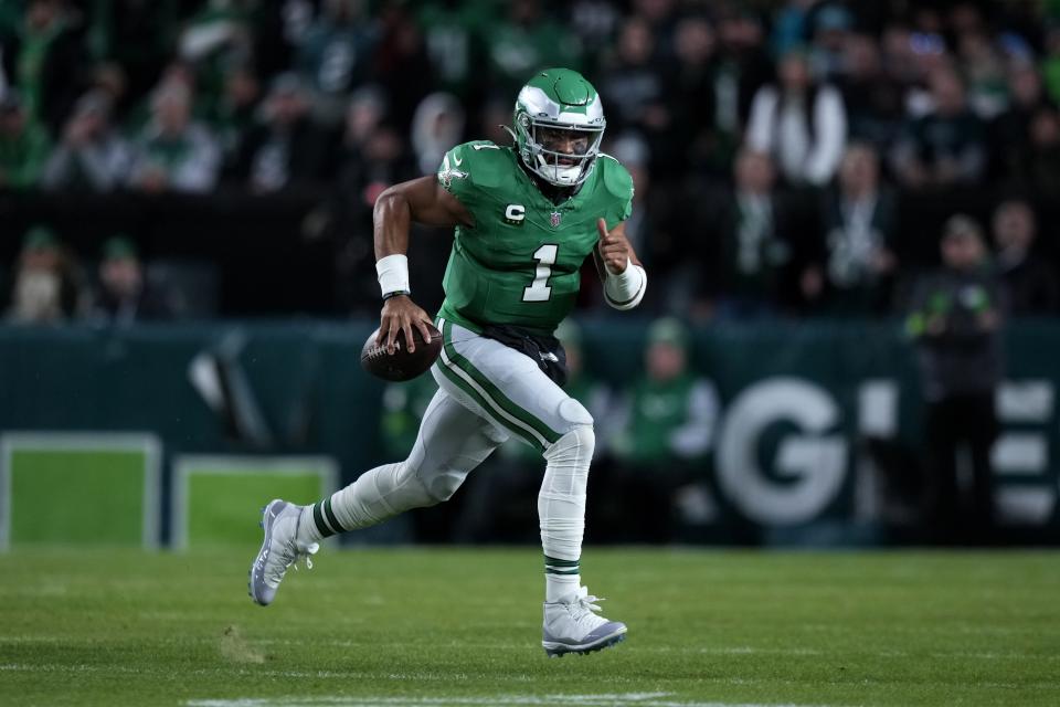 Philadelphia Eagles quarterback Jalen Hurts (1) runs with the ball during the first half of an NFL football game against the Miami Dolphins on Sunday, Oct. 22, 2023, in Philadelphia. (AP Photo/Matt Slocum)