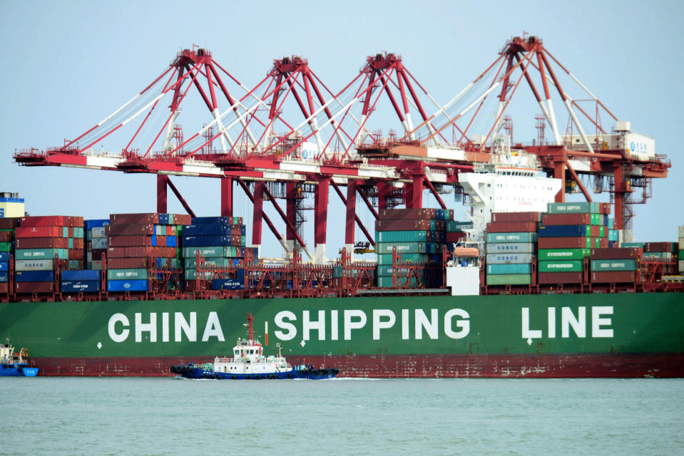 FILE – In this April 13, 2018, file photo, a China Shipping container ship is seen at the port in Qingdao in eastern China’s Shandong province. China has accused the United States on Thursday, June 21, 2018, of using pressure tactics and blackmail in threatening to impose tariffs on hundreds of billions of dollars of Chinese imports. (Chinatopix via AP, File)