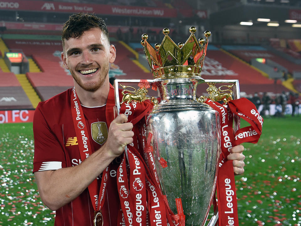 Liverpool full-back Andy Robertson with the Premier League trophyLiverpool FC via Getty Images