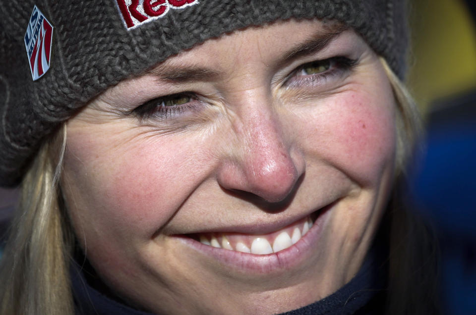 FILE - In this Dec. 4, 2013 file photo, Lindsey Vonn smiles at the finish area following her training run at the women's World Cup downhill ski event in Lake Louise, Alberta, Canada. Vonn is going to skip the Sochi Olympics because of a right knee injury. Her personal publicist, Lewis Kay, says in a statement Tuesday, Jan. 7, 2014, that Vonn "will have surgery shortly." The 29-year-old American won two medals at the 2010 Vancouver Olympics, including a gold in the downhill. She is also a four-time overall World Cup champion and the biggest name in Alpine skiing. (AP Photo/The Canadian Press, Jeff McIntosh)