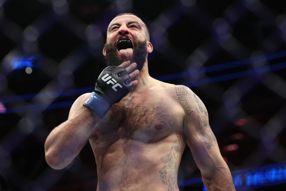 Dec 3, 2022; Orlando, Florida, USA; Roman Dolidze (blue gloves) reacts after fighting Jack Hermansson (red gloves) during UFC Fight Night at Amway Center. Mandatory Credit: Nathan Ray Seebeck-USA TODAY Sports