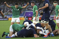 Ireland's players celebrate after James Ryan scored a try during the Rugby World Cup Pool A game at International Stadium between Ireland and Scotland in Yokohama, Japan, Sunday, Sept. 22, 2019. (AP Photo/Eugene Hoshiko)