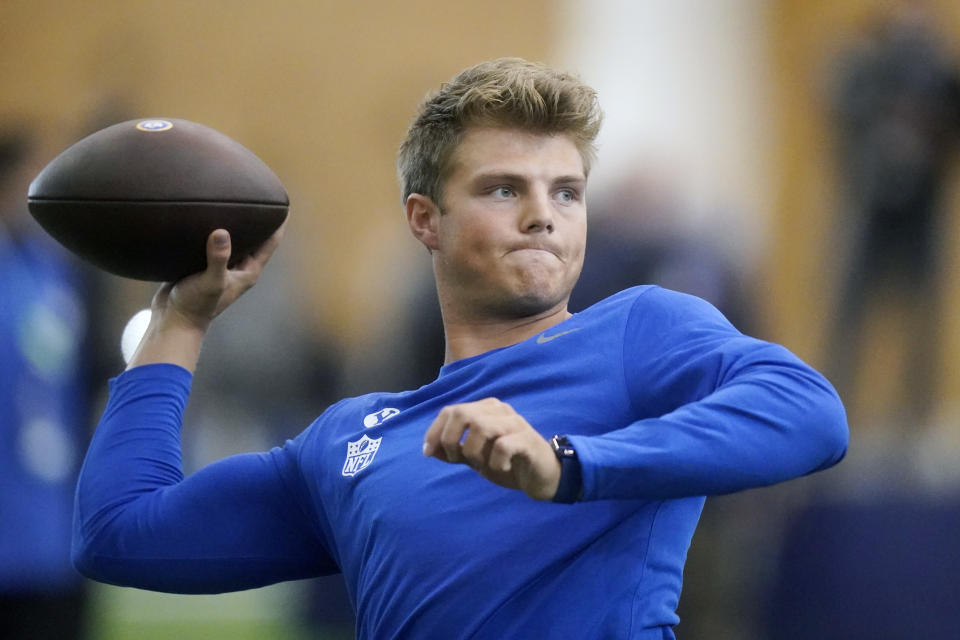 FILE - BYU quarterback Zach Wilson warms up before participating in the school's Pro Day football workout for NFL scouts in Provo, Utah, in this Friday, March 26, 2021, file photo. The New York Jets head into the NFL draft needing a quarterback and they hope to find the face of the franchise who can develop into a star and lead them to sustained success. The overwhelming favorite to hear his name selected by the Jets with No. 2 pick is BYU’s Zach Wilson. (AP Photo/Rick Bowmer, File)