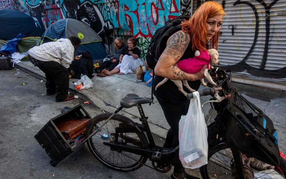 Drug users in Tenderloin, San Francisco hanging out together on the pavement