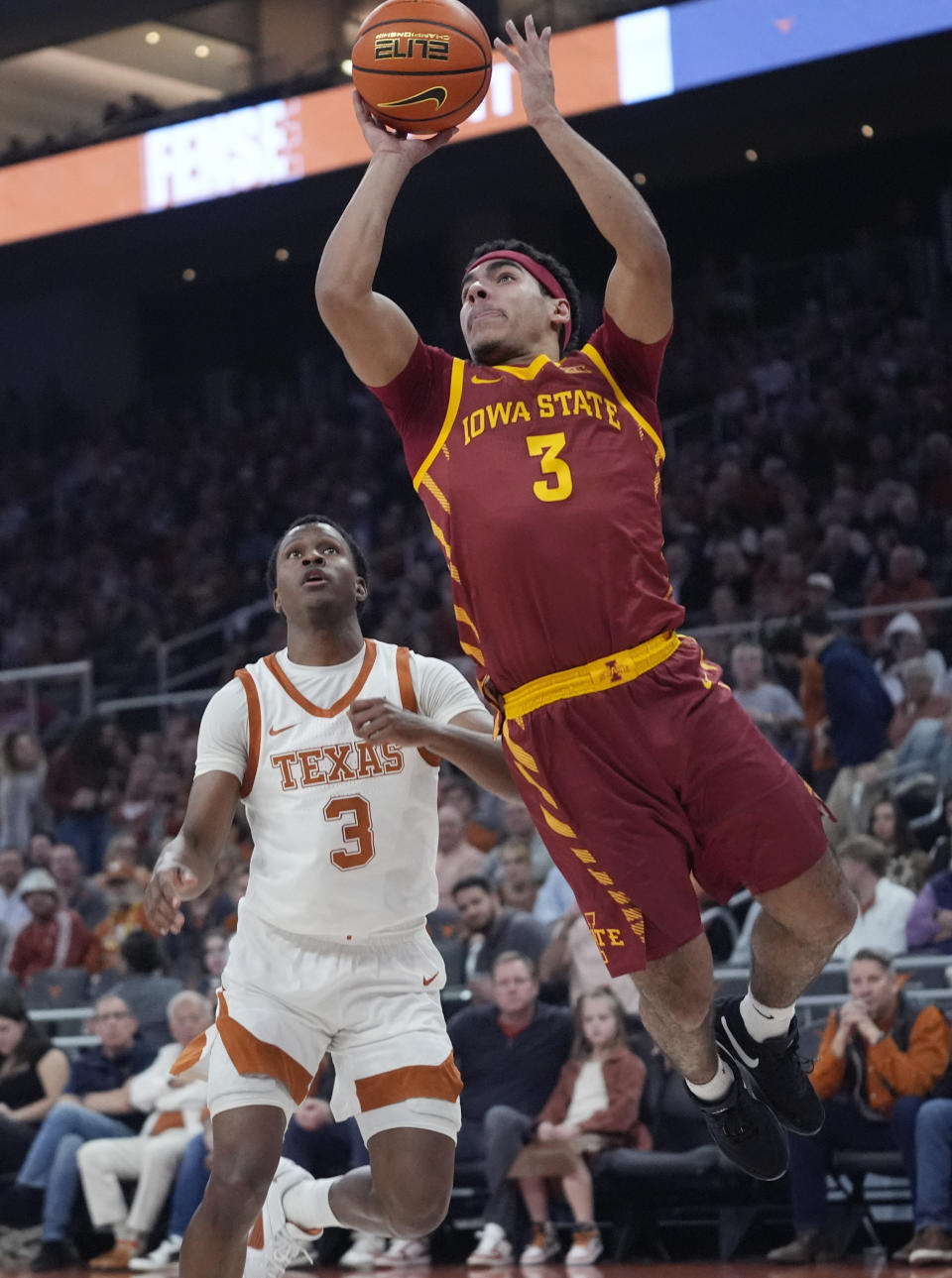 Iowa State guard Tamin Lipsey shoots in front of Texas guard Max Abmas during the first half of an NCAA college basketball game Tuesday, Feb. 6, 2024, in Austin, Texas. (AP Photo/Eric Gay)