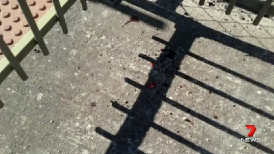 The victim's blood still stains the concrete. Photo: 7 News