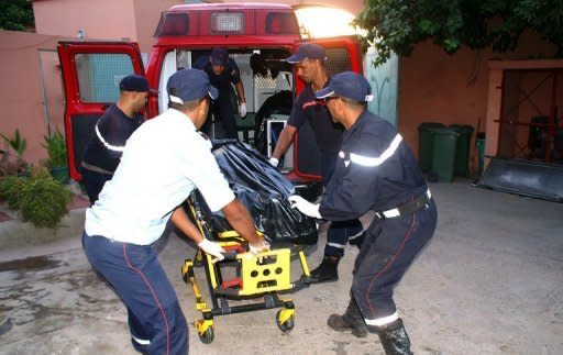 Moroccan rescuers carry the body of a passenger who was killed in a bus crash near Marrakech, in the morgue of the hospital Ibnou Iofail on September 4, 2012. At least 42 people were killed Tuesday when a bus travelling between Marrakesh and Ouarzazate in southern Morocco plunged into a ravine, a security official said