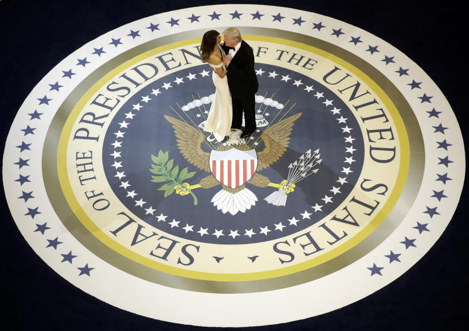 FILE - In this Jan. 20, 2017, file photo, President Donald Trump dances with first lady Melania Trump at The Salute To Our Armed Services Inaugural Ball. (AP Photo/Evan Vucci, File)