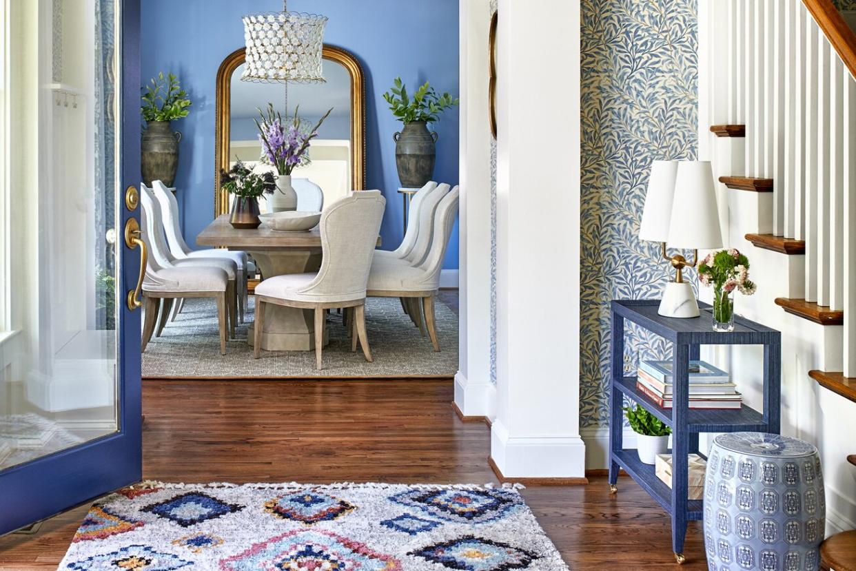 entryway with chicago blue-painted front door