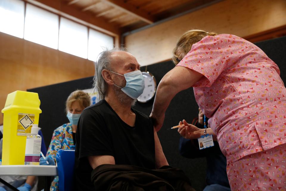 <p>John Lewis, 84, is given his Covid-19 vaccination at the Princess Royal Sports Arena in Boston, England</p> (Getty Images)