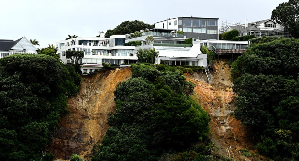 Several houses are nearing collapse as Auckland continues to experience severe rainfall causing landslides. Source: Getty