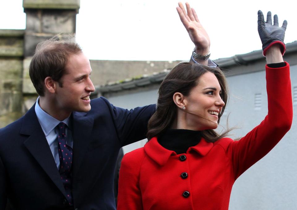 Prince William (L) and his fiancee Kate Middleton wave as they pass St Salvator's halls during a visit to the University of St Andrews in Scotland on February 25, 2011. During the visit they viewed the surviving Papal Bull (the university's founding document), unveiled a plaque, and met a selection of the University’s current staff and students to mark the start of the Anniversary. Prince William and Kate Middleton attended the university as students from 2001 to 2005 and began their romance in St Andrews.2011