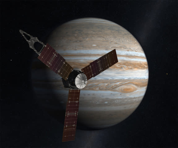 The Juno spacecraft passes in front of Jupiter in this artist's depiction.