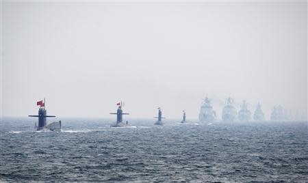 Chinese Navy submarines and warships take part in an international fleet review to celebrate the 60th anniversary of the founding of the People's Liberation Army Navy in Qingdao, Shandong province, in this April 23, 2009 file photo. REUTERS/Guang Niu/Pool/Files