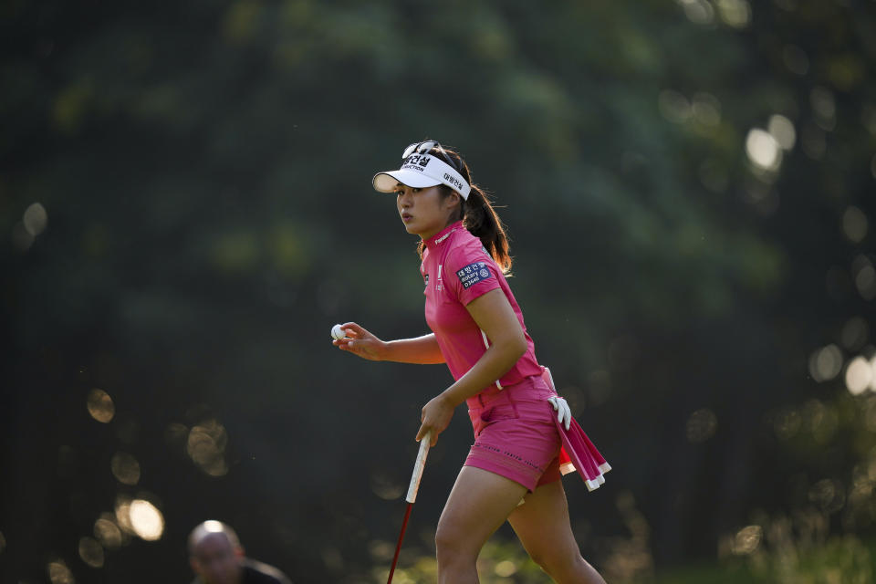 Jeongeun Lee6, of South Korea, acknowledges applause from the crowd after making par on the 17th hole during the third round at the LPGA CPKC Canadian Women's Open golf tournament in Vancouver, British Columbia, Saturday, Aug. 26, 2023. (Darryl Dyck/The Canadian Press via AP)