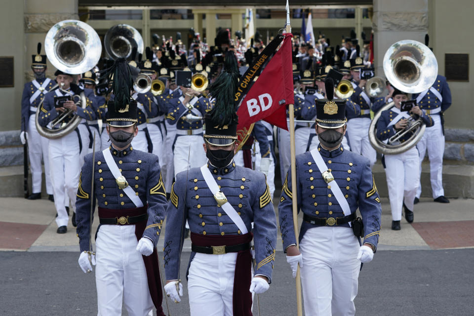 Virginia Military Institute Corp of Cadets march out of the barracks during a change of command parade and ceremony on the parade grounds at the school in Lexington, Va., Friday, May 14, 2021. Kasey Meredith was installed as the first female to lead the Virginia Military Institute's Corps of Cadets in its 182 year history. (AP Photo/Steve Helber)