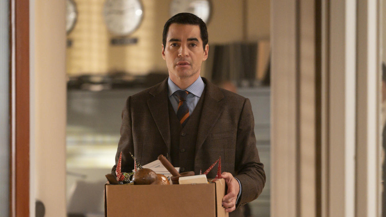  Ramon Rodriguez as Will Trent carrying a box in Season 2. 