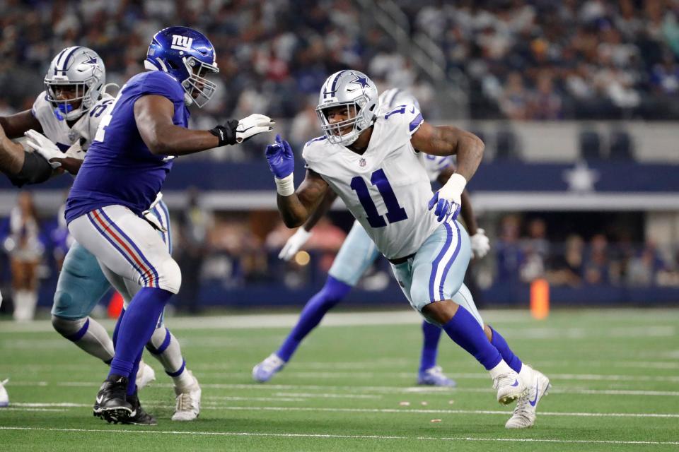 Dallas Cowboys linebacker Micah Parsons (11) rushes the passer against the defense of New York Giants offensive tackle Matt Peart, left, during the second half in Arlington, Texas, on Sunday, Oct. 10, 2021.