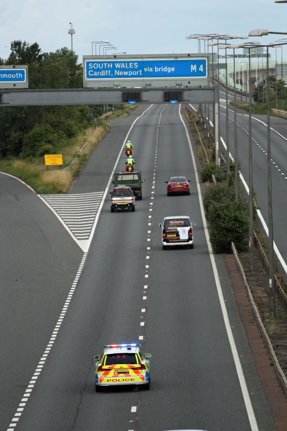 Police escort vehicles along the M4 motorway during the morning rush hour as drivers hold a go-slow protest on the M4. Police have warned of 