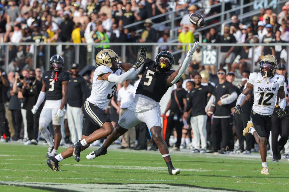 Sep 28, 2024; Orlando, Florida, USA; Colorado Buffaloes cornerback Colton Hood (3) stops a catch by UCF Knights tight end Randy Pittman Jr. (5) during the second quarter at FBC Mortgage Stadium. Mandatory Credit: Mike Watters-Imagn Images