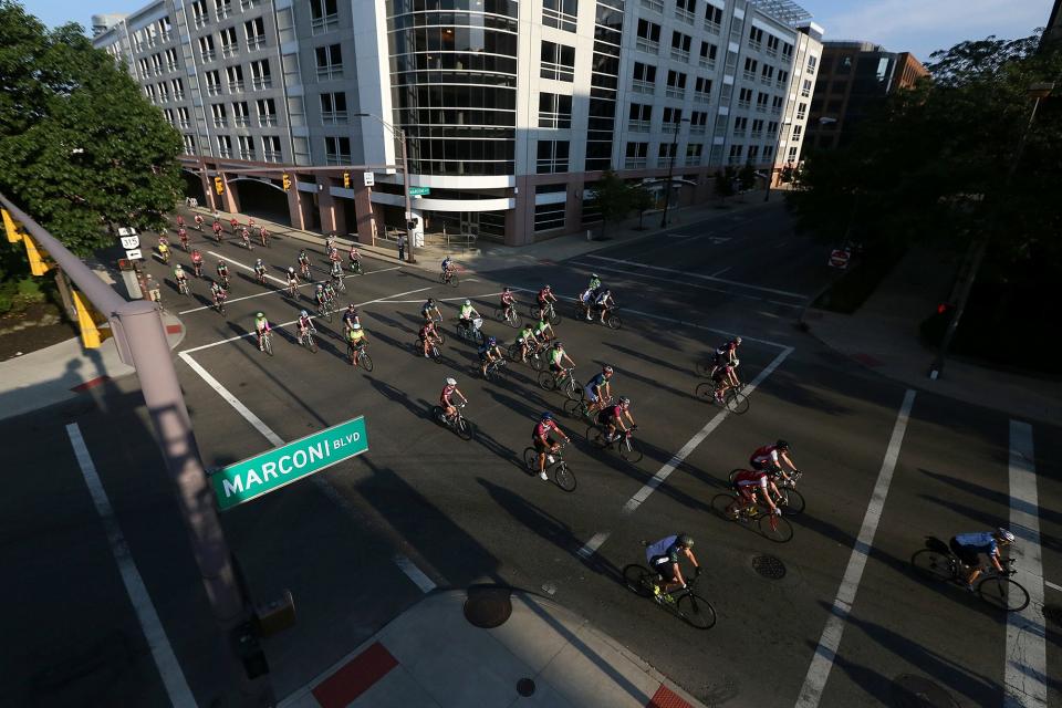 A group of bicyclists take off from the Pelotonia start at the McFerson Commons in 2014.