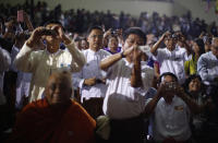 Members of the audience take pictures as U.S. President Barack Obama delivers remarks at the University of Yangon, November 19, 2012. REUTERS/Jason Reed (MYANMAR - Tags: POLITICS EDUCATION)