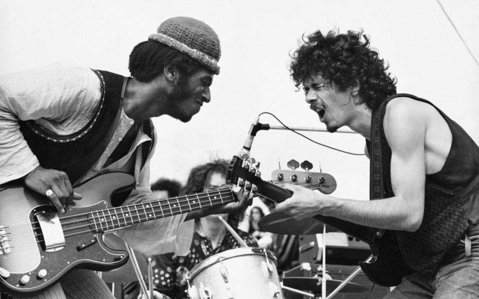 “It is extremely scary to be in front of 150,000 people and the neck of your guitar feels like an electric snake." Santana with David Brown at Woodstock in 1969 - Getty