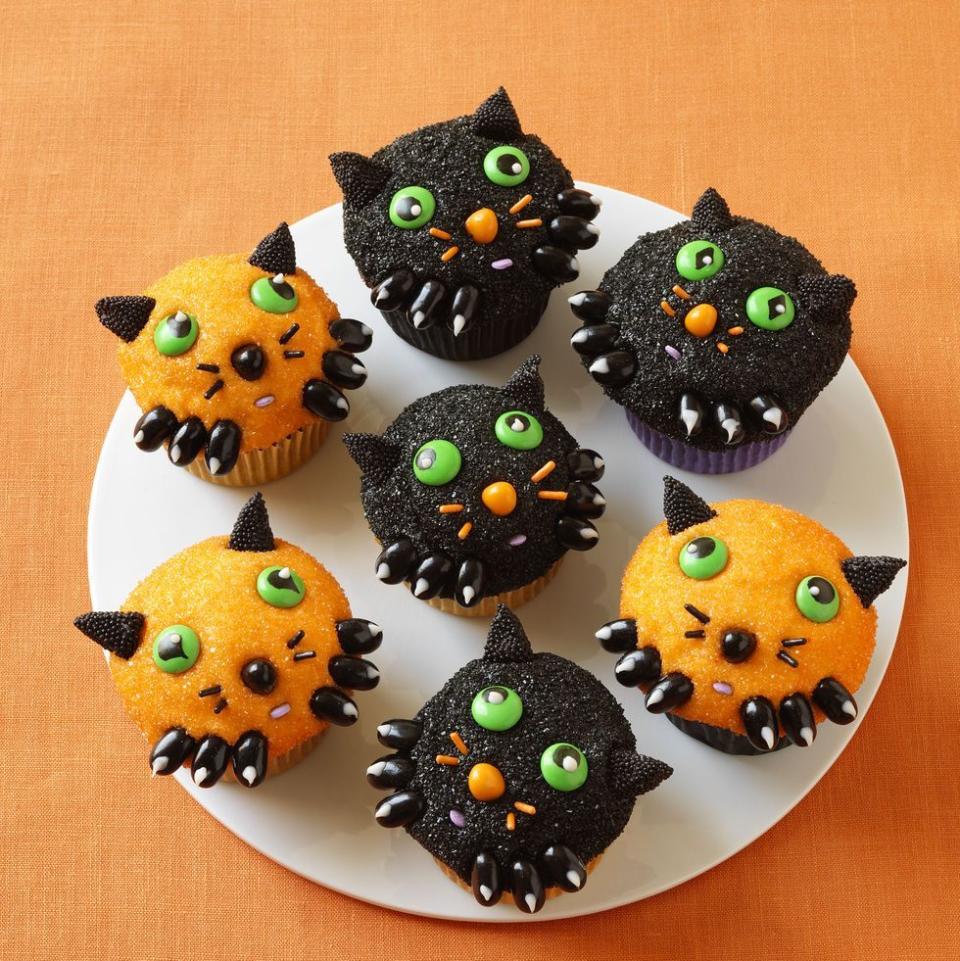 <p>This treat isn't scary at all! Once you bake your cupcakes, just frost them and dip them in black and orange sanding sugars. Add the little faces using candy and sprinkles.</p><p>Get the <a href="https://www.womansday.com/food-recipes/food-drinks/recipes/a11375/kitten-cupcakes-recipe-wdy1012/" rel="nofollow noopener" target="_blank" data-ylk="slk:Kitten Cupcakes recipe;elm:context_link;itc:0;sec:content-canvas" class="link "><strong>Kitten Cupcakes recipe</strong></a>.</p>