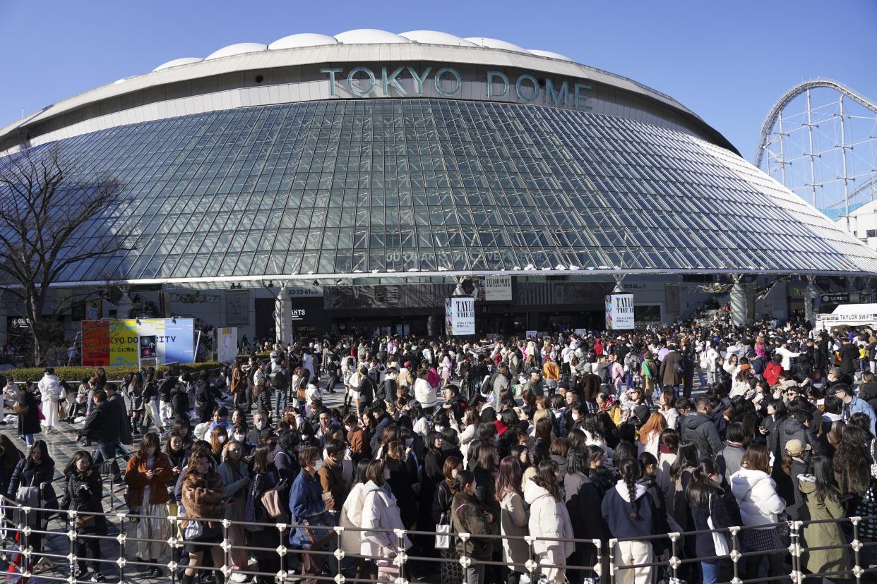 Fans arrive at the Tokyo Dome before the Taylor Swift concert in Tokyo.