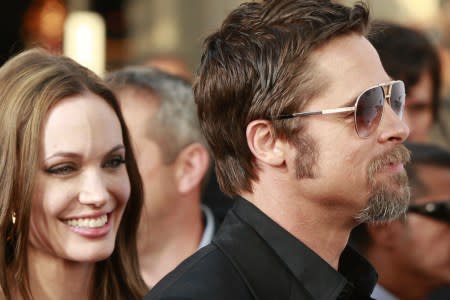 Angelina Jolie and Brad Pitt walk the red carpet