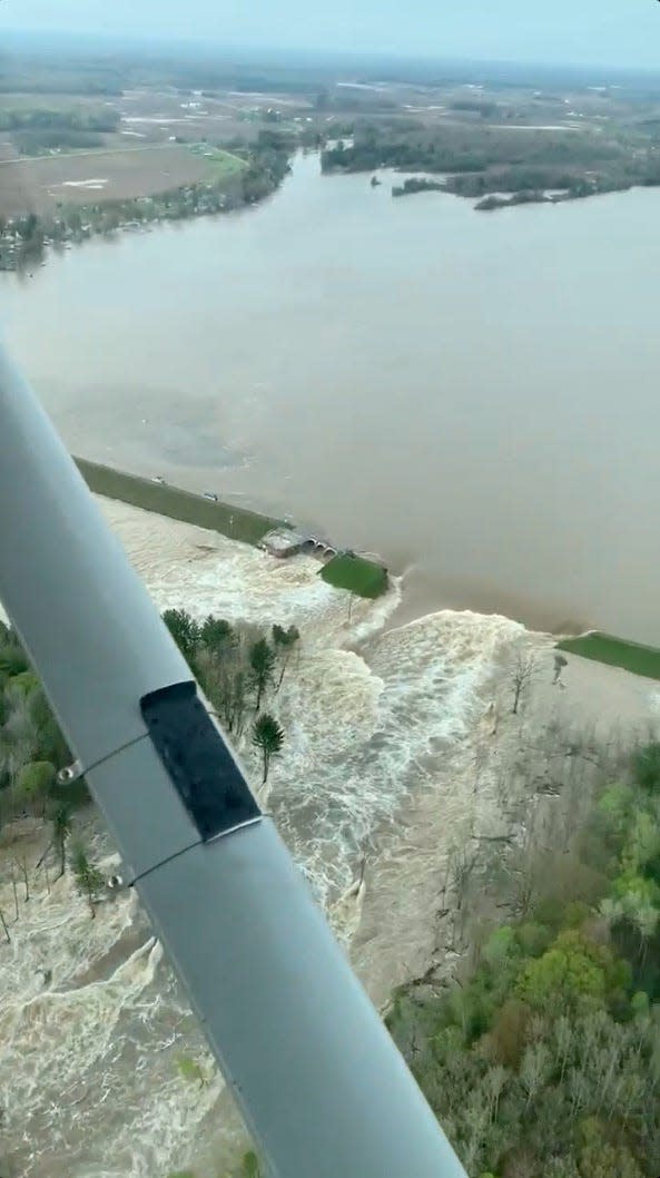 Aerial view of water from a broken Edenville Dam seen flooding the area as it flows towards Wixom Lake in Michigan, U.S. in this still frame obtained from social media video dated May 19, 2020. RYAN KALETO/via REUTERS