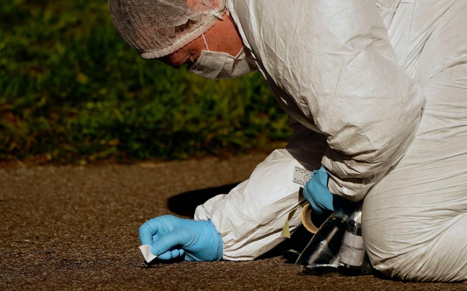 A forensic officer at Regency Court in Brentwood, Essex, where two teenage boys died in the early hours of Sunday morning - PA 