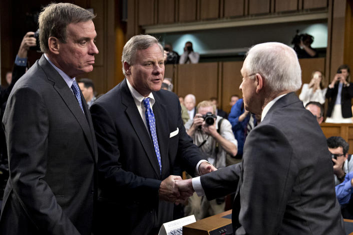 <p>Jeff Sessions, U.S. attorney general, right, shakes hands with Senator Richard Burr, a Republican from North Carolina and chairman of the Senate Intelligence Committee, next to ranking member Senator Mark Warner, a Democrat from Virginia, left, before a hearing in Washington, D.C., on Tuesday, June 13, 2017. (Andrew Harrer/Bloomberg via Getty Images) </p>