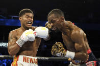 Shakur Stevenson, left, lands a punch to Jamel Herring during a junior lightweight boxing bout in Atlanta early Sunday, Oct. 24, 2021. Stevenson won the bout. (AP Photo/Ben Gray)