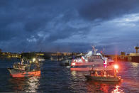 French fishing boats block the entrance to the port of Saint-Malo, western France, Friday, Nov. 26, 2021. French fishing crews are threatening to block French ports and traffic under the English Channel on Friday to disrupt the flow of goods to the U.K., in a dispute over post-Brexit fishing licenses. (AP Photo/Jeremias Gonzalez)