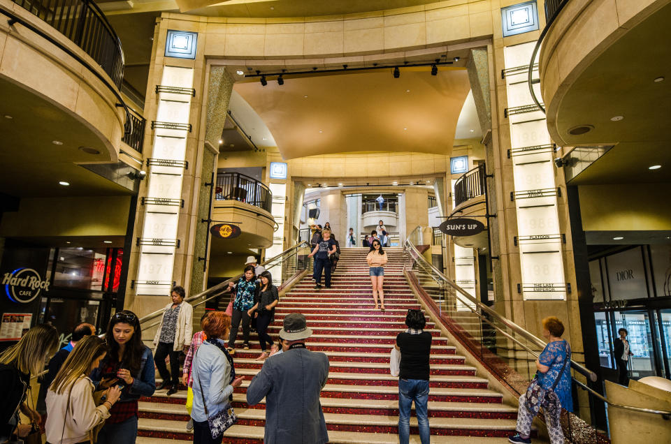 A few dozen shoppers on a long staircase presumably leading up to the Dolby Theater.