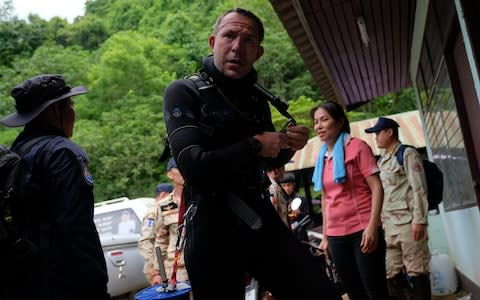 British cave-divers John Volanthen removes his diving suit after walking out from Tham Luang Nang Non cave on June 28 - Credit: Linh Pham /Getty