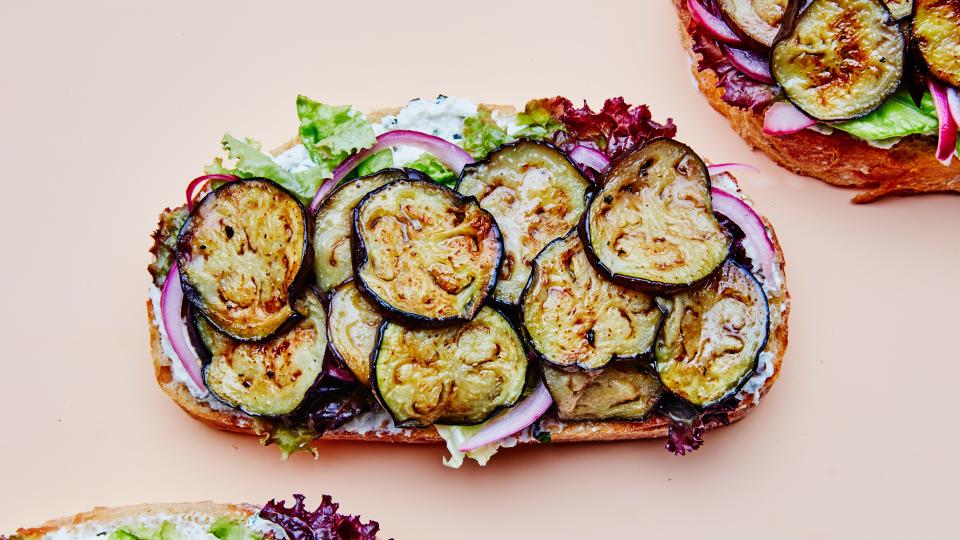 Yes, an open-faced sandwich is still a sandwich. And it’s one you’ll happily gobble down when it’s piled with seared and marinated eggplant, honey-garlic ricotta, fresh basil, and toasted walnuts. <a href="https://www.bonappetit.com/recipe/big-eggplant-sandwiches-with-ricotta-and-pickled-onions?mbid=synd_yahoo_rss" rel="nofollow noopener" target="_blank" data-ylk="slk:See recipe.;elm:context_link;itc:0;sec:content-canvas" class="link ">See recipe.</a>