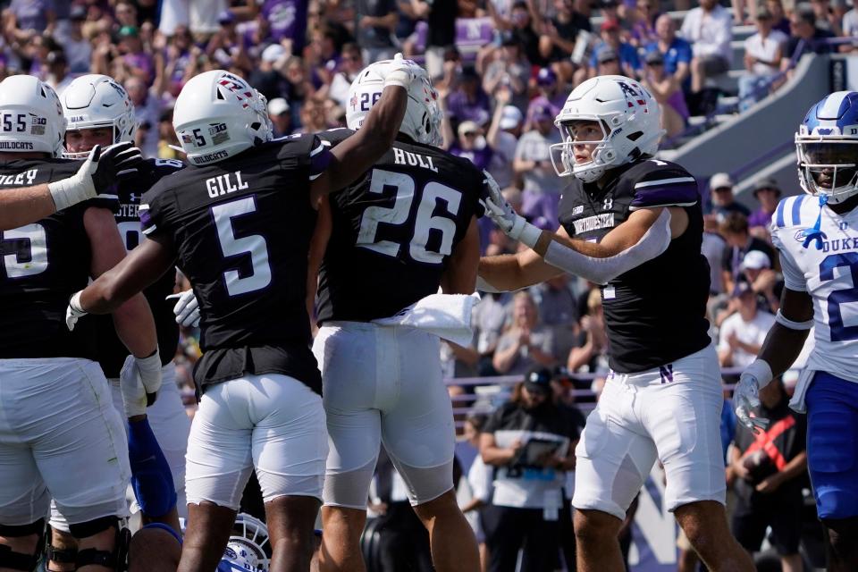 Northwestern running back Evan Hull (26) celebrates his touchdown against Duke during the first half of an NCAA college football game, Saturday, Sept.10, 2022, in Evanston, Ill. (AP Photo/David Banks)